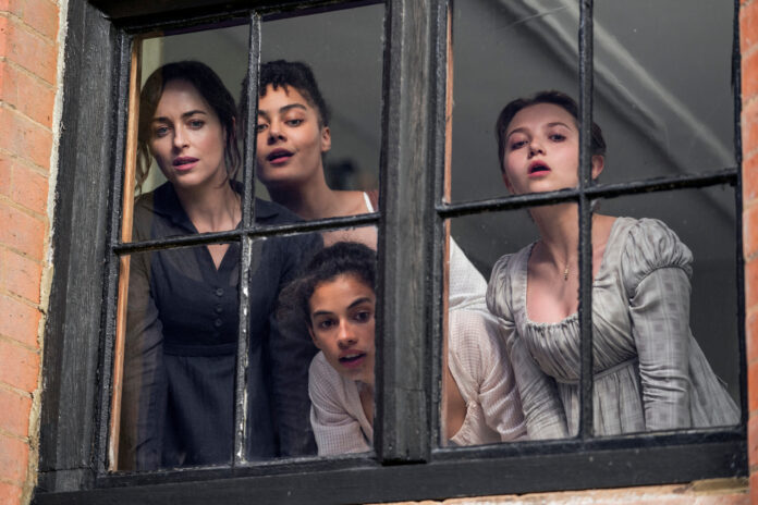 Persuasion. (L to R) Dakota Johnson as Anne Elliot, Izuka Hoyle as Henrietta Musgrove, Nia Towle as Louisa Musgrove, Mia McKenna-Bruce as Mary Elliot in Persuasion. Cr. Nick Wall/Netflix © 2022