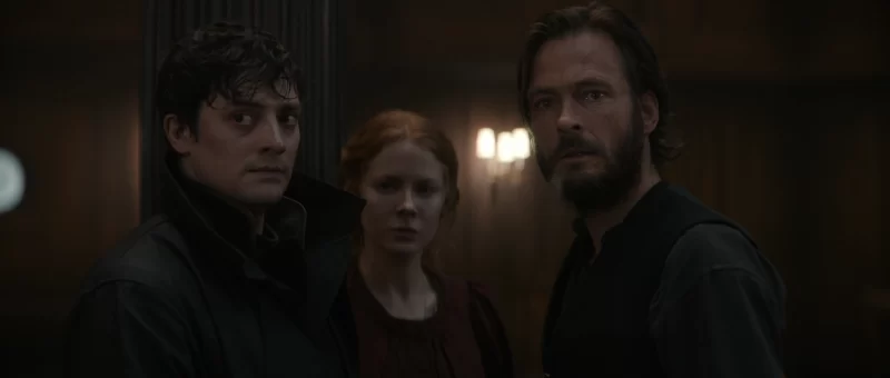 Andreas Pietschmann, Emily Beecham, and Aneurin Barnard in The Calling (2022)