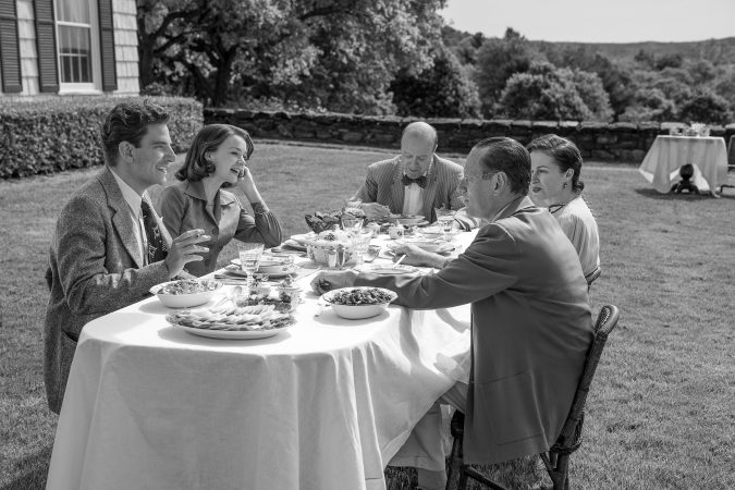 Maestro. (L to R) Bradley Cooper as Leonard Bernstein (Director/Writer/Producer), Carey Mulligan as Felicia Montealegre, Yasen Peyankov as Serge Koussevitzky, Julia Aku as Olga and Brian Klugman as Aaron Copland in Maestro. Cr. Jason McDonald/Netflix © 2023.