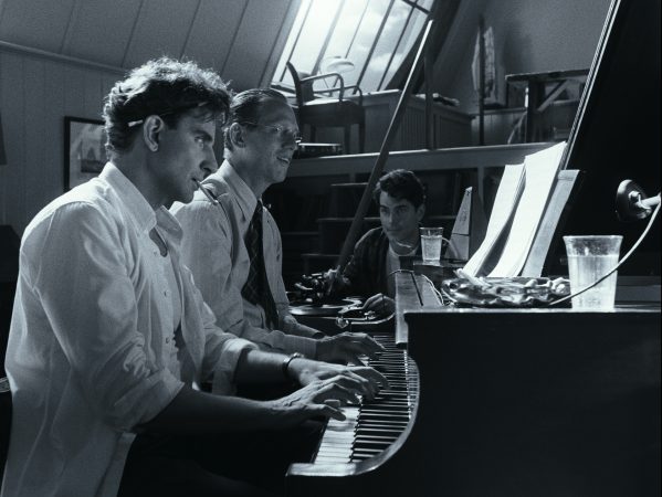 Maestro. (L to R) Bradley Cooper as Leonard Bernstein (Director/Writer/Producer), Brian Klugman as Aaron Copland and Matt Bomer as David Oppenheim in Maestro. Cr. Courtesy of Netflix © 2023.