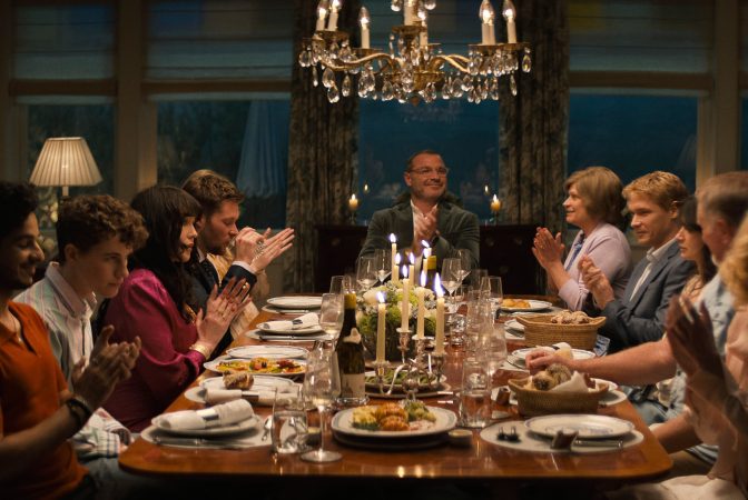 The Perfect Couple. (L to R) Ishaan Khattar as Shooter Dival, Sam Nivola as Will Winbury, Isabelle Adjani as Isabel Nallet, Jack Reynor as Thomas Winbury, Liev Schreiber as Tag Winbury, Dendrie Taylor as Karen Sacks, Billy Howle as Benji Winbury, Eve Hewson as Amelia Sacks, Michael McGrady as Bruce Sacks in episode 103 of The Perfect Couple. Cr. Courtesy of Netflix © 2024