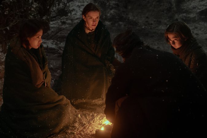 AMERICAN PRIMEVAL. (L to R) Shawnee Pourier as Two Moons, Betty Gilpin as Sara Rowell, Taylor Kitsch as Isaac, and Preston Mota as Devin Rowell in Episode 103 of American Primeval. Cr. Matt Kennedy/NETFLIX © 2023