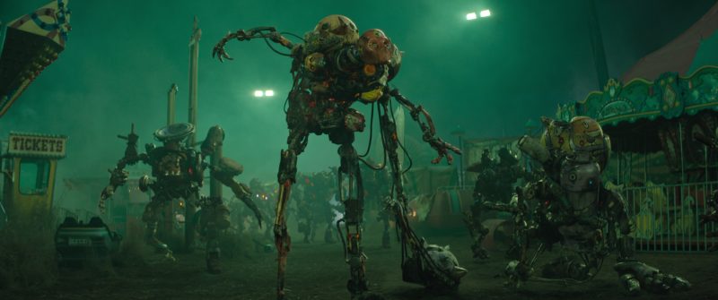The Electric State; Various Scavs stalk our heros in an abandoned amusement park in The Electric State. ?/© 2024 Netflix.  Used with permission.