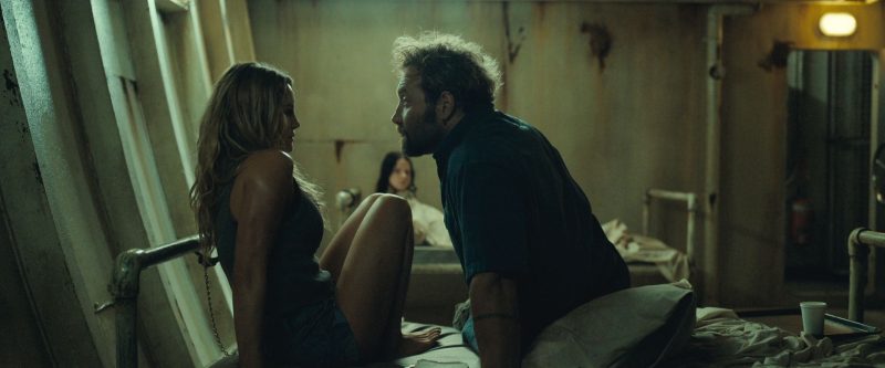 Jai Courtney, Hassie Harrison, and Ella Newton in Dangerous Animals (2025)