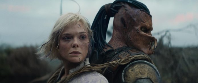 Dimitrius Schuster-Koloamatangi and Elle Fanning in Predator: Badlands (2025)
